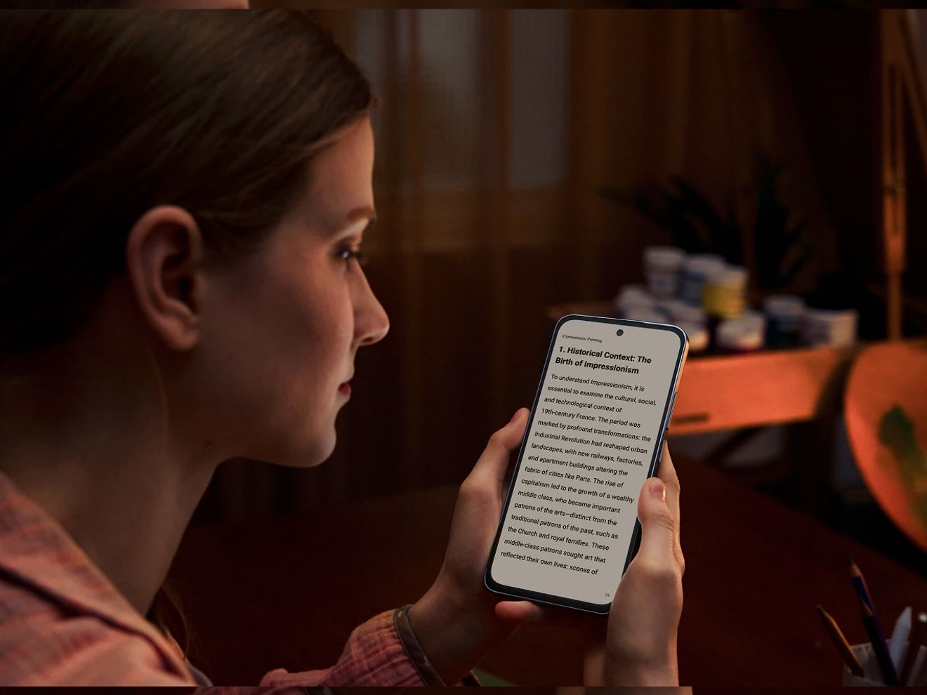 Woman looks at a NXTPAPER 70 Pro smartphone with adaptable display.