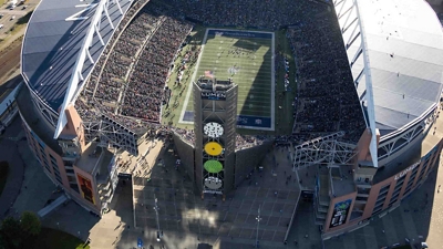 An overhead view of a football stadium during a game.