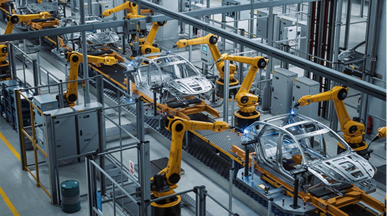 Overhead view of automated assembly line for automobile manufacturing.