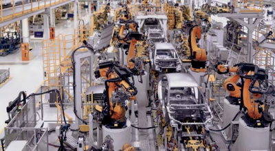 A high-angle shot of an advanced automobile factory.