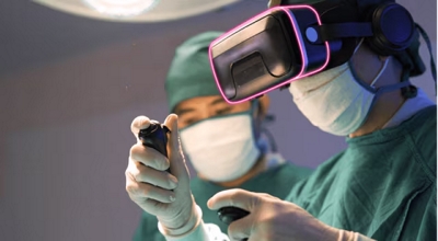 Two surgeons; one operates a VR headset.