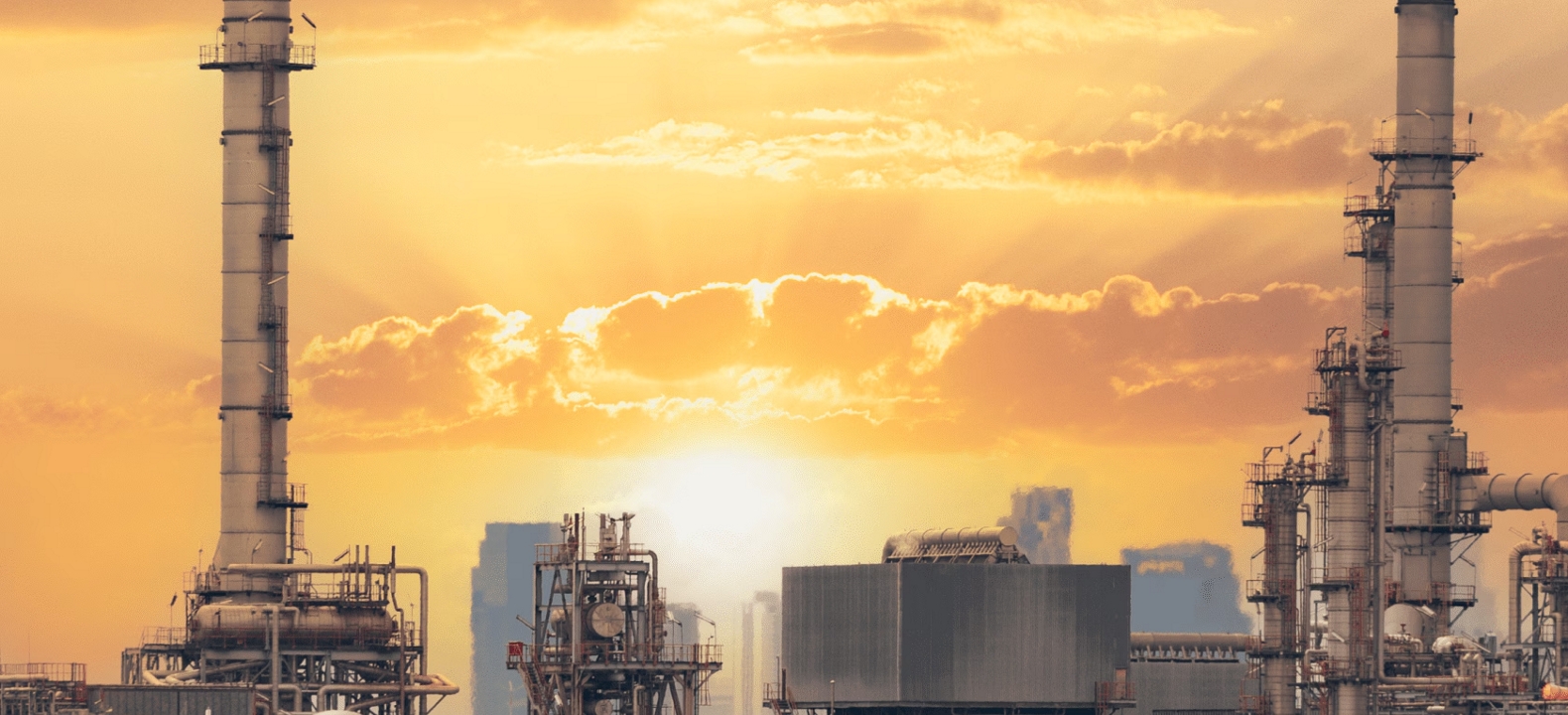 A manufacturing plant at sunrise.