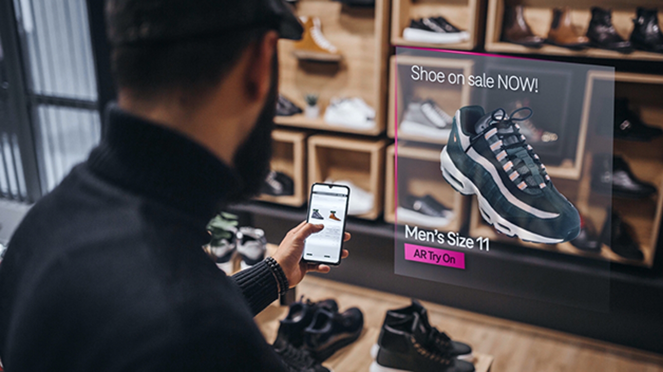 Man shopping for sneakers on a smartphone using an AR image.