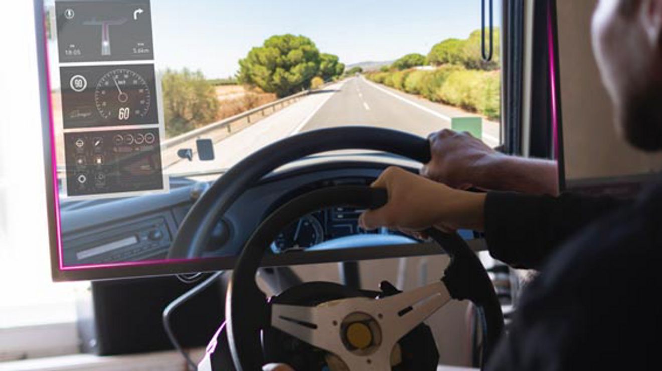 A commercial driving trainee uses a driving simulator.