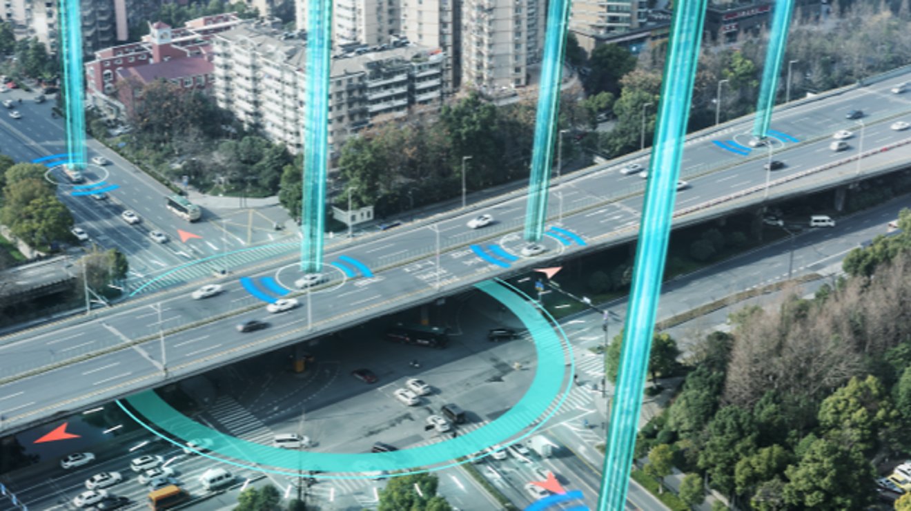 Bird’s eye view of busy downtown streets, with signals, beams, and rings indicating connected cars.