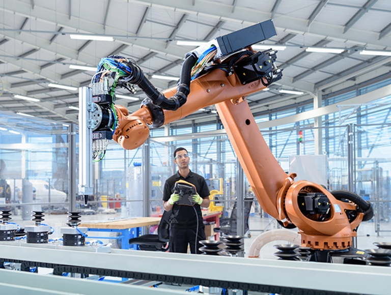 Man and woman, both in business attire, wear VR headsets.