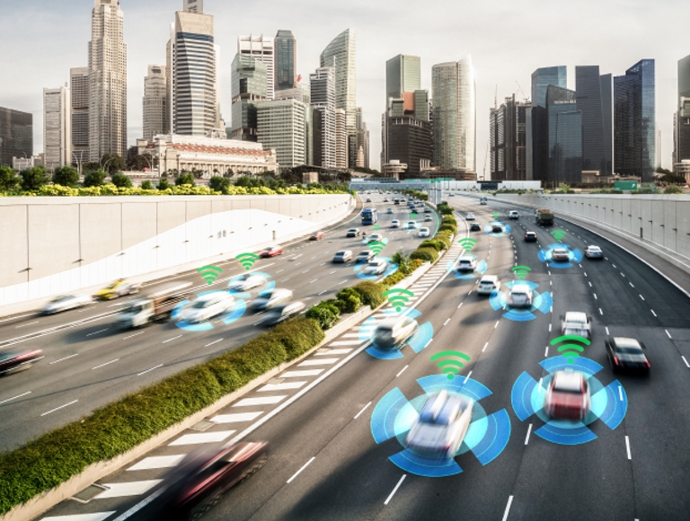 AI cars traveling on a freeway with a skyline in the background
