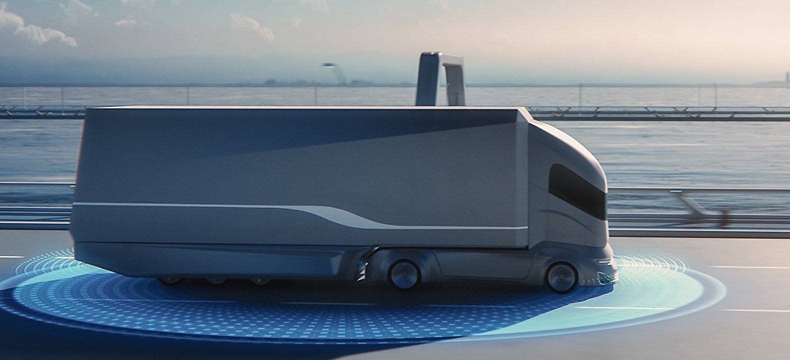 Self-driving tractor trailer moves along a coastal highway