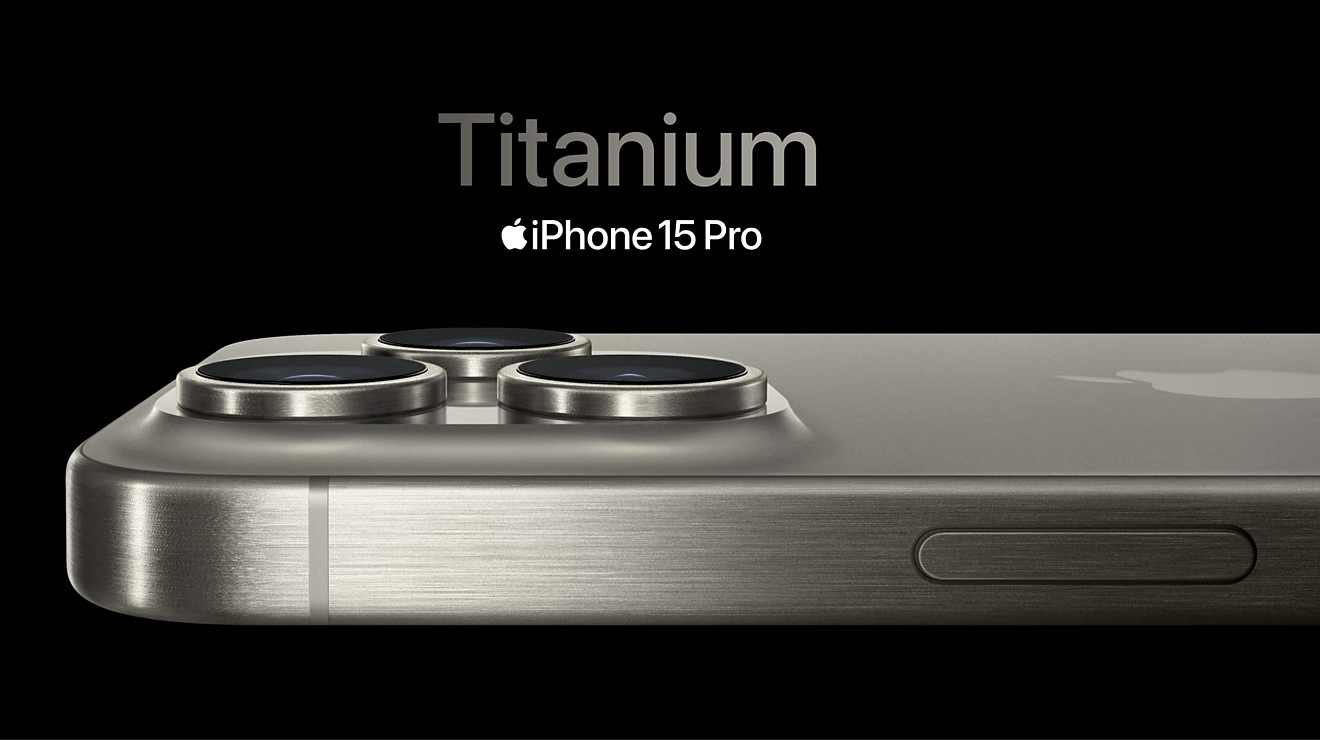 A Titanium iPhone 15 Pro seen horizontally from its edge below the Titanium iPhone 15 Pro logo.