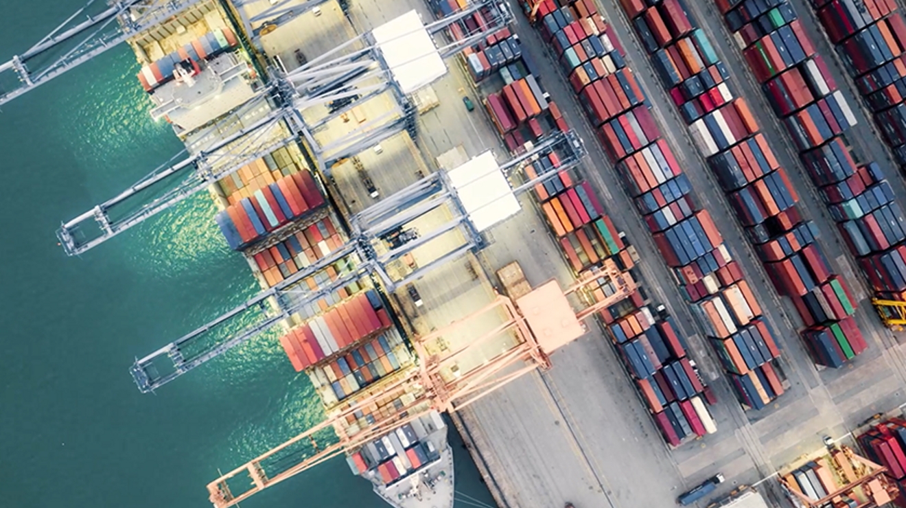 Overhead image of a dock with several containers.