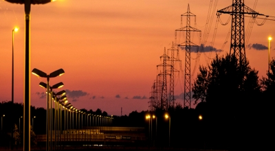 Streetlights and powerlines at dusk.