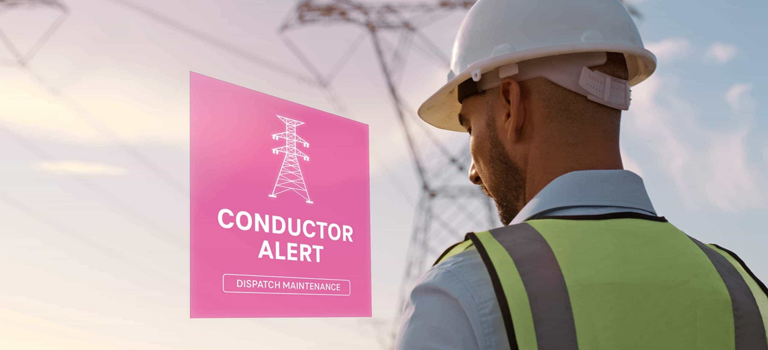 Working on their tablet outside, an electrical engineer sees an alert about a power conductor.