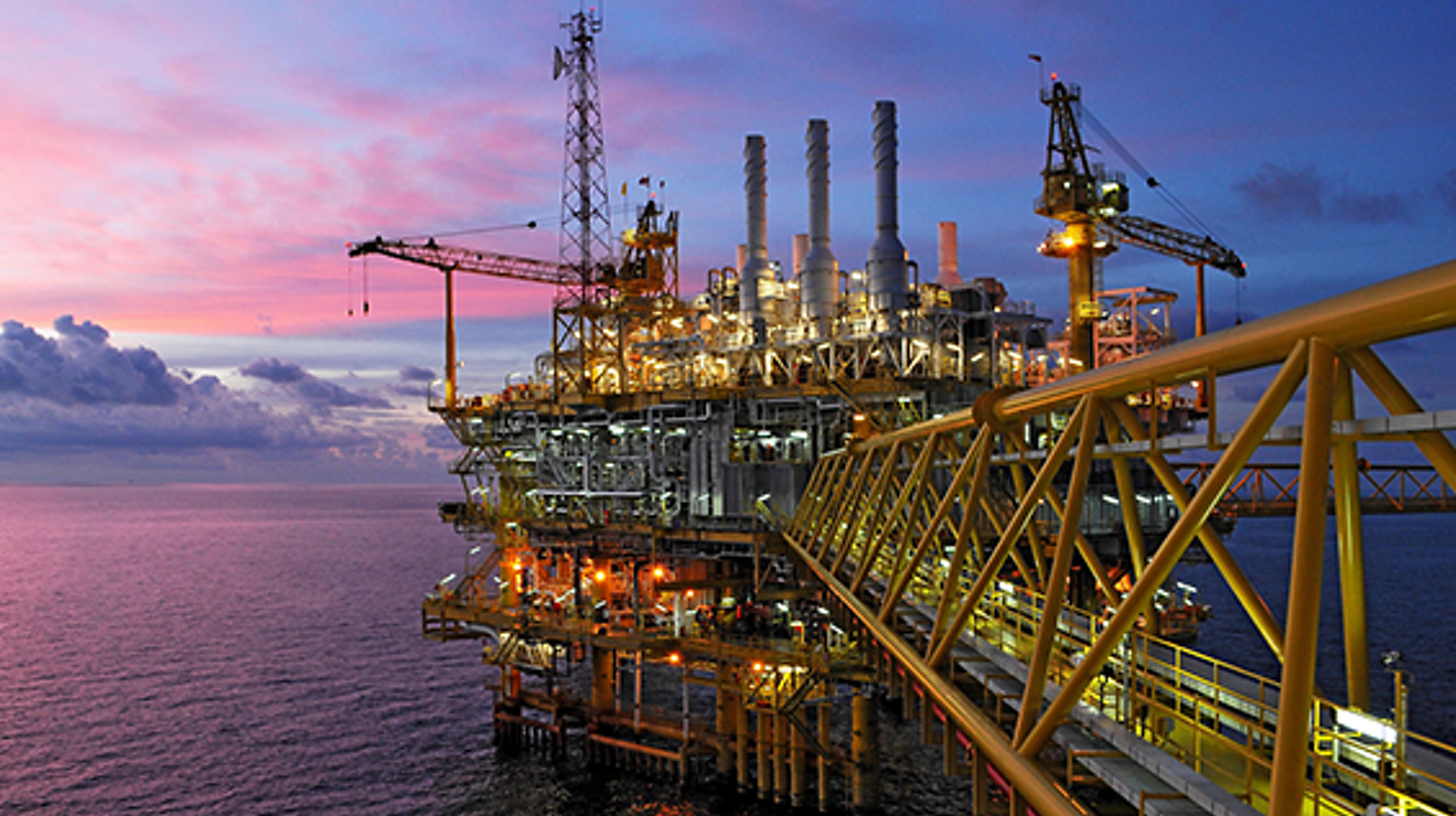 Offshore oil rig platform at dusk.