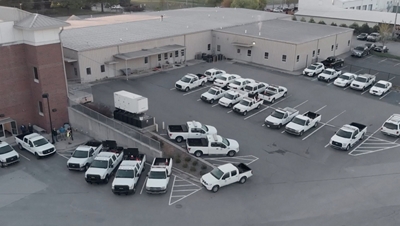 Parking lot of white trucks