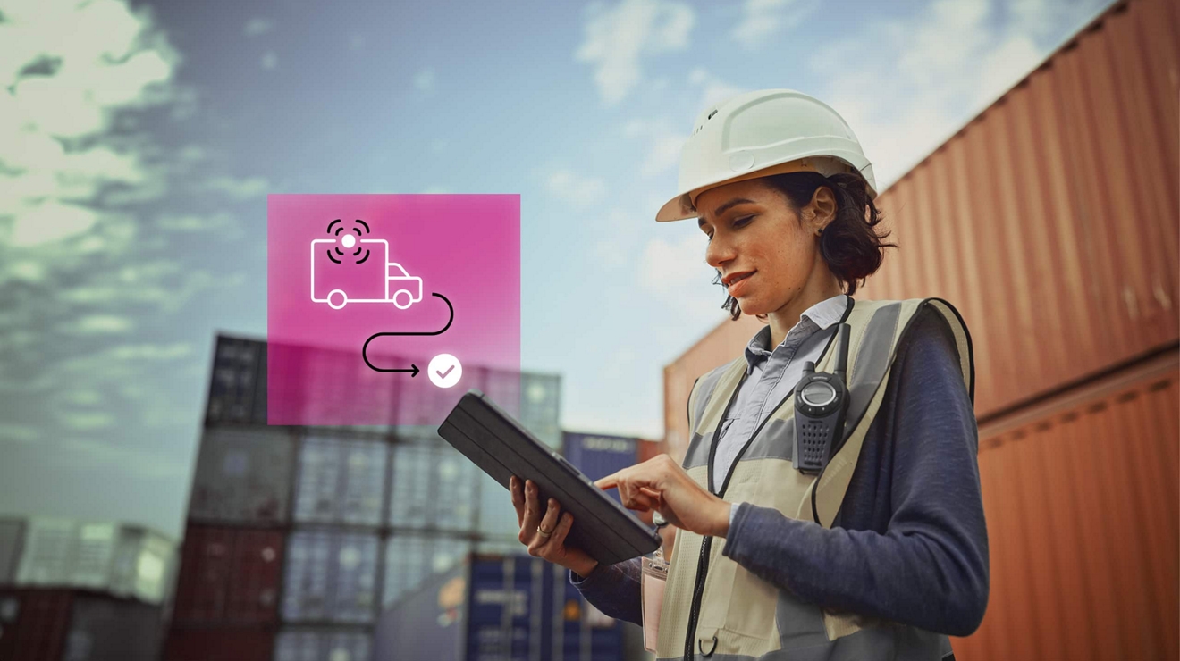 Fleet manager in protective gear tracks a container’s route on their connected tablet.