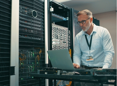 A technician working in a server room.