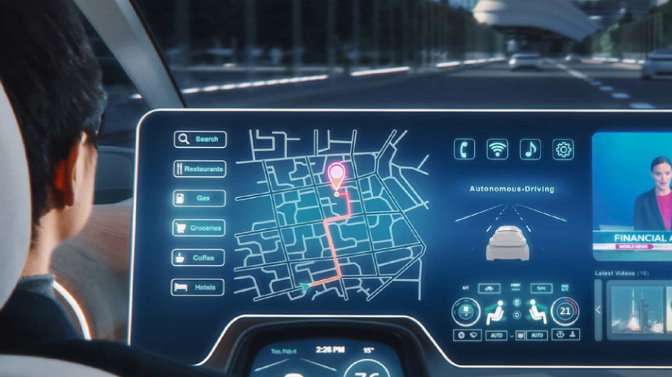 A car’s digital dashboard displays information such as the car’s speed, a roadmap, videos, and more.