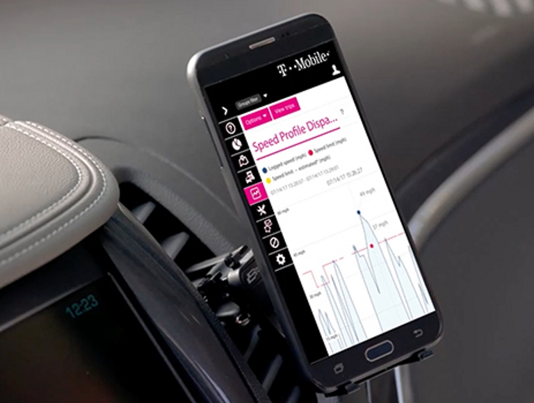 Mounted mobile phone in a car showing fleet analytics