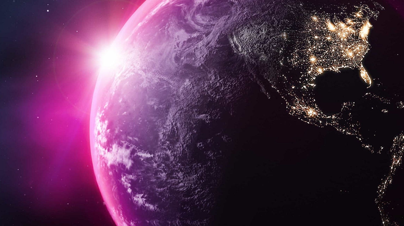 The Earth from space, with connected points of light on the North and South America continents. 