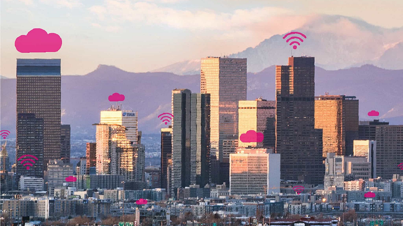 A city skyline with magenta clouds and connectivity bands above the buildings.