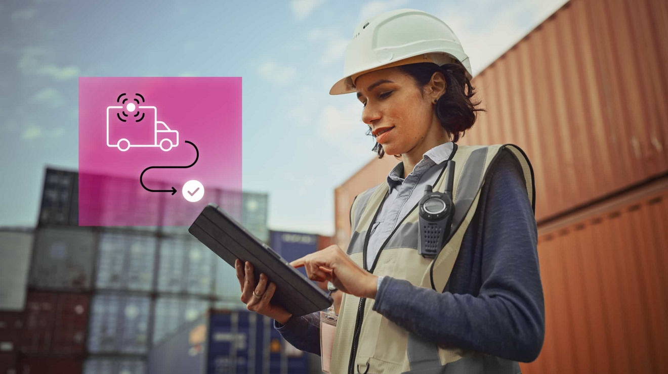 Fleet manager in protective gear tracks a container’s route on their connected tablet.