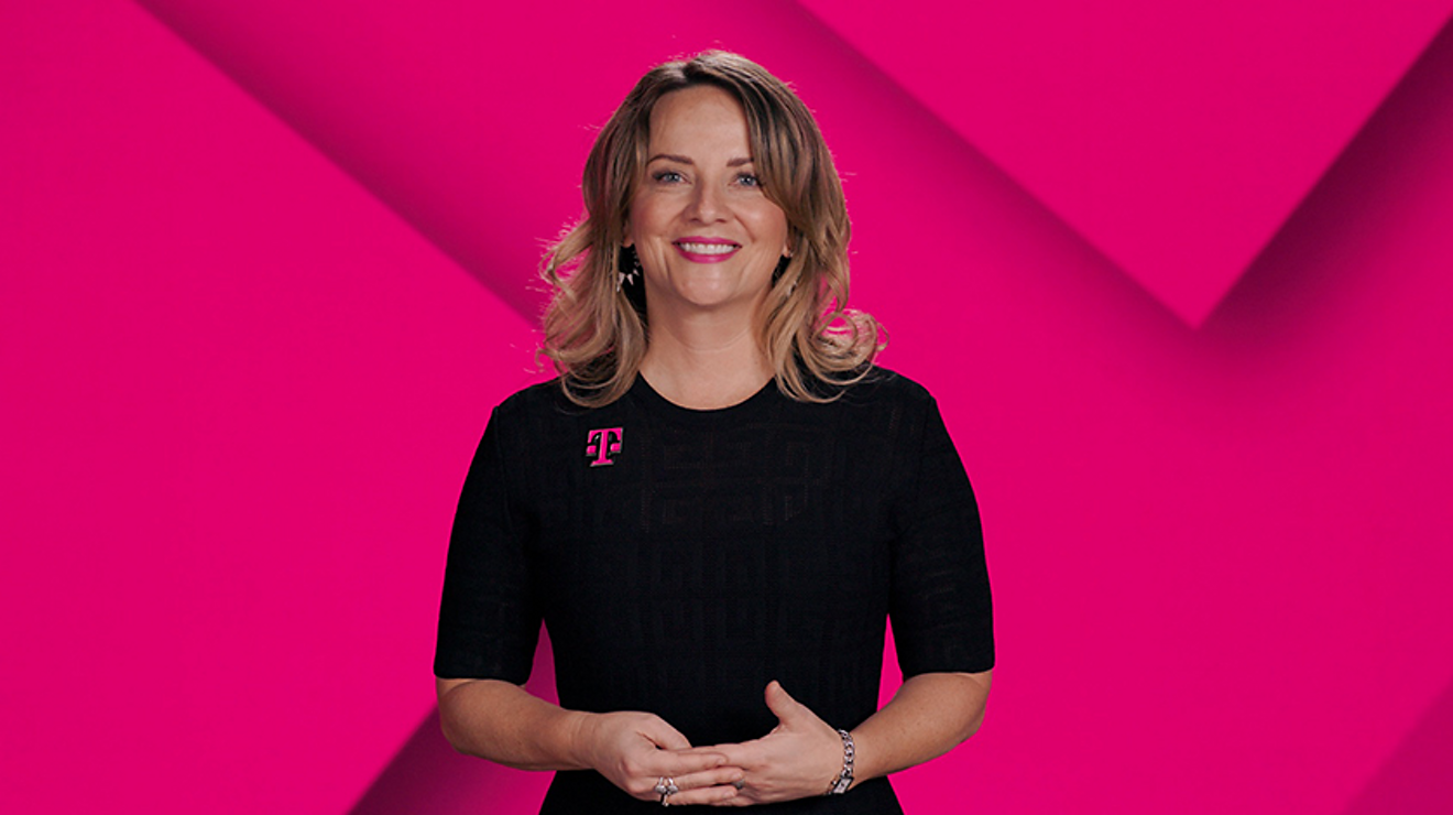 Woman with T-Mobile logo on black dress with magenta background 