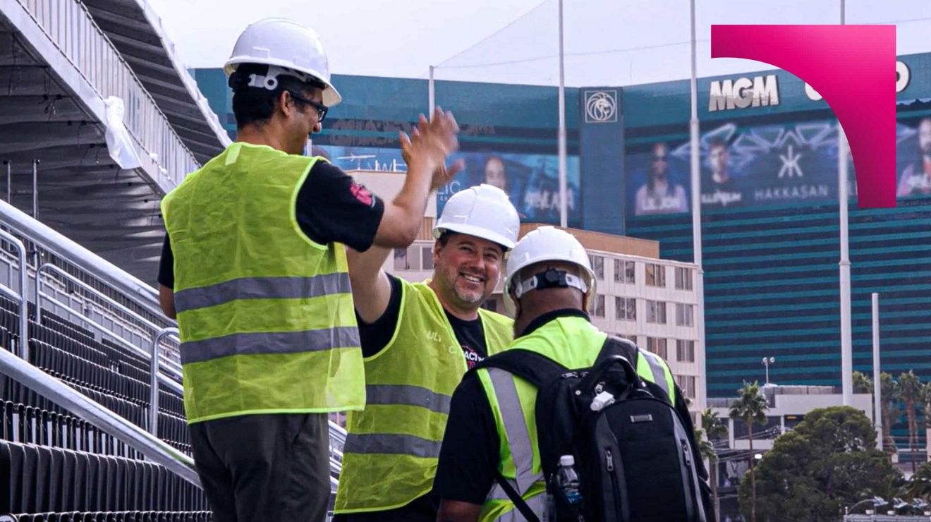 construction workers high fiving in vegas