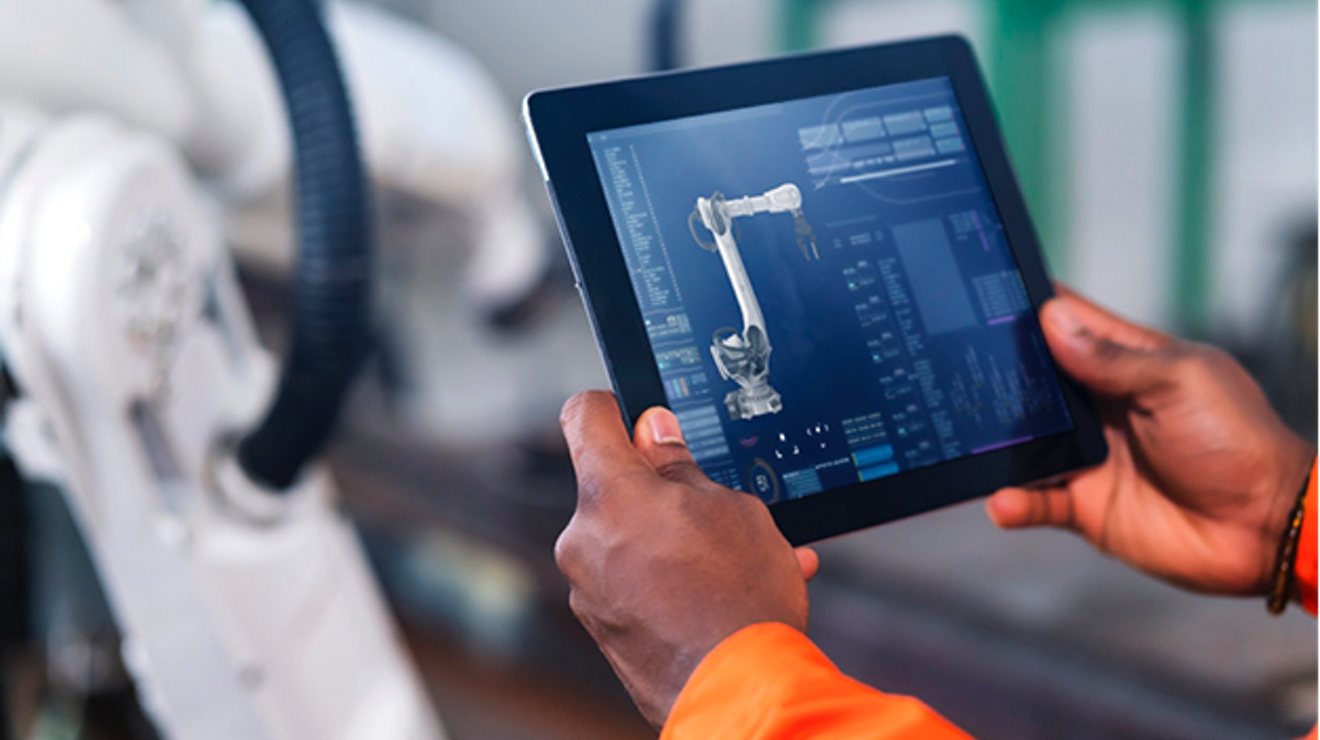 Two hands hold a tablet displaying a technical drawing with specifications