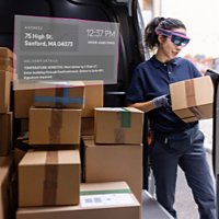 Courier worker with boxes for delivery and a hologram with numbers and information next to her