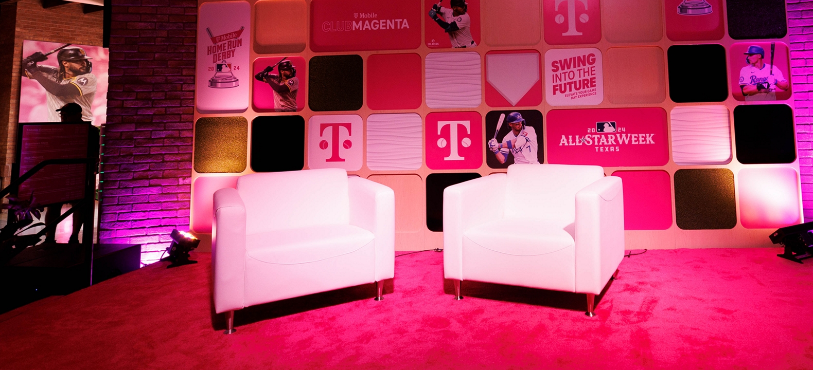 Two chairs facing each other inside Club Magenta, where the talent appearances will sit. 