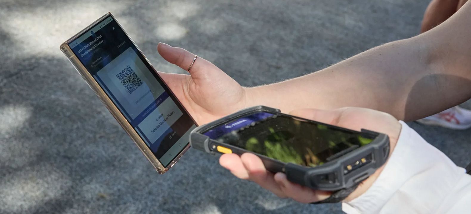Close-up of a mobile ticket being scanned.