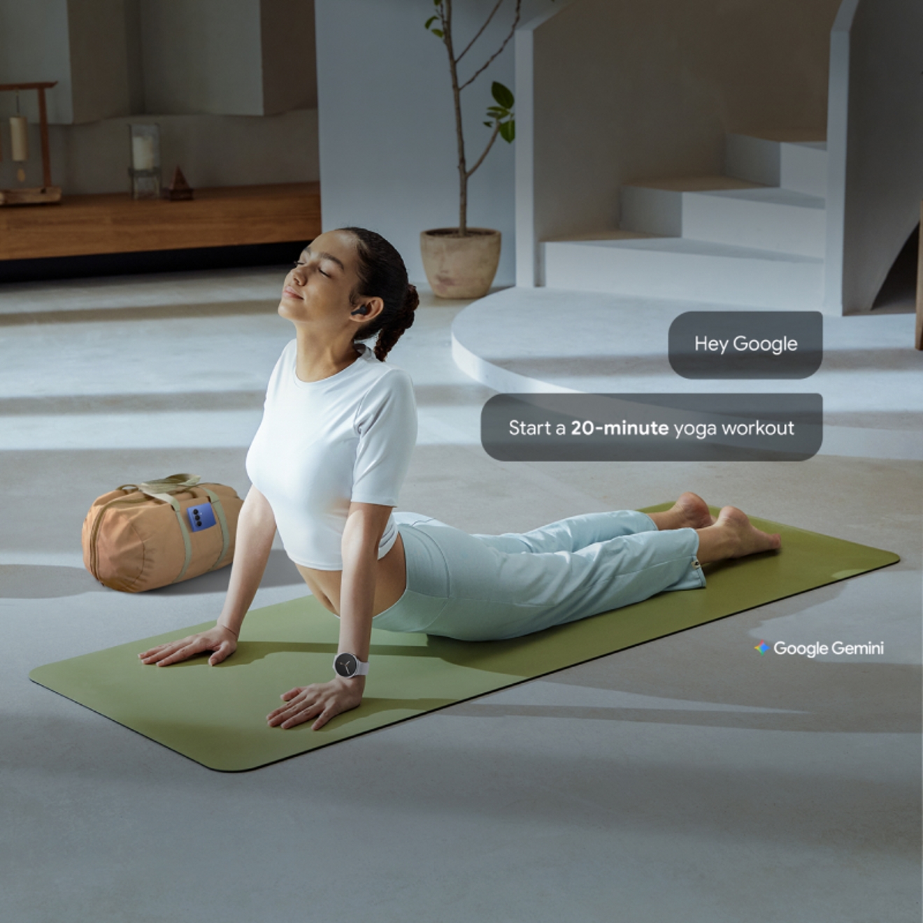 Person doing yoga with Galaxy Buds3 FE in ears, conversation bubbles show them asking Gemini to start a 20-minute yoga workout.