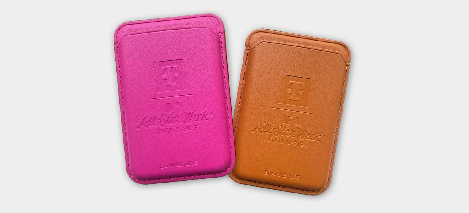 Two phone wallets featuring the T-Mobile and MLB All-Star Week logos.