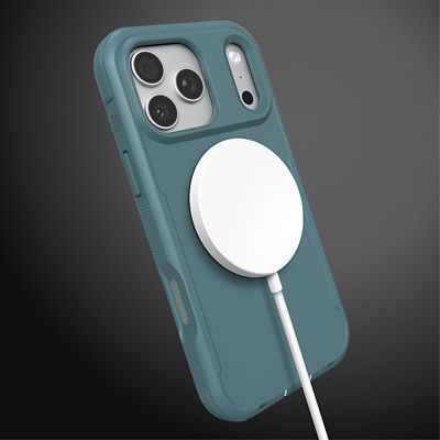 A silver iPhone 17 Pro in a blue ZAGG Teton protective case charges with a white MagSafe charger magnetically attached to the back.