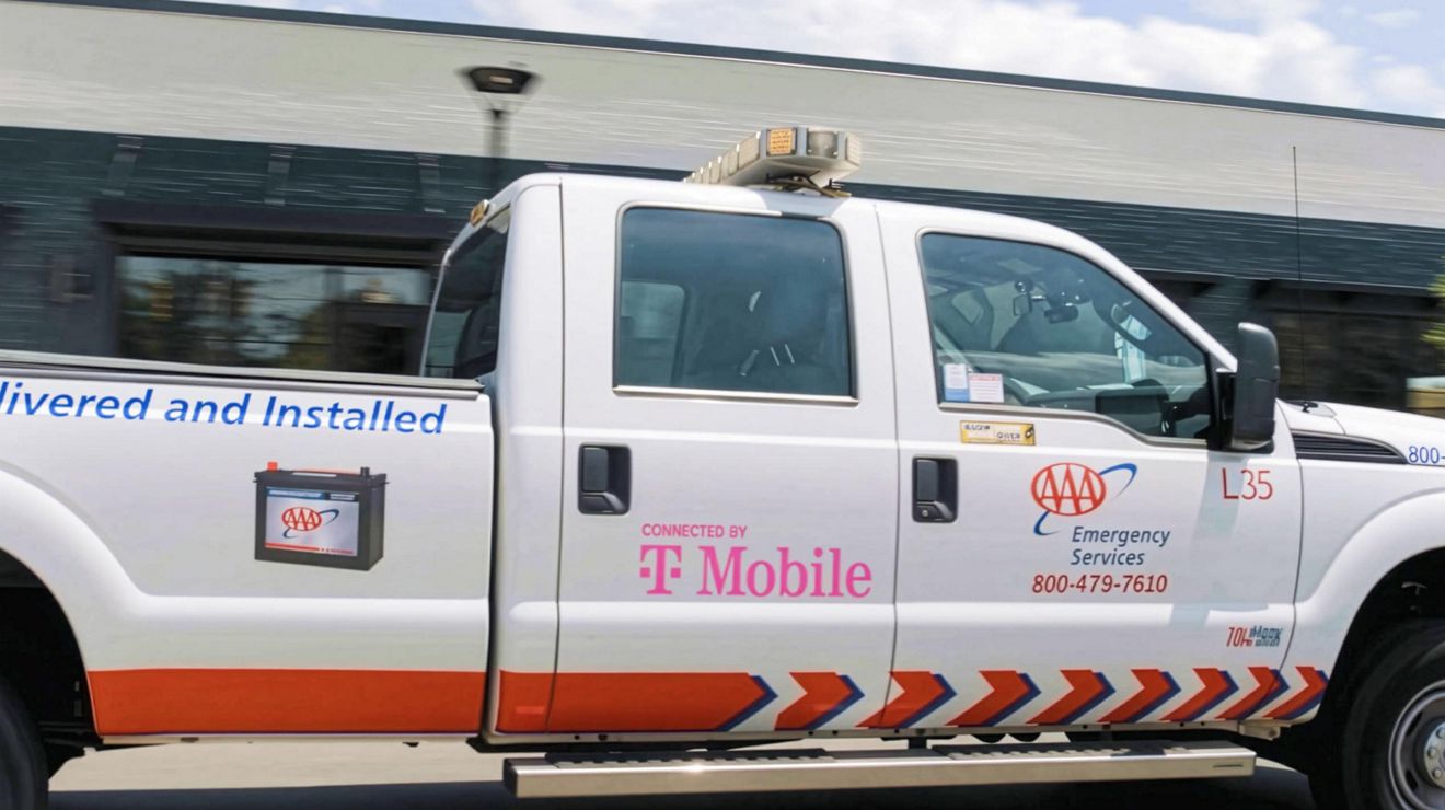 A  AAA truck connected by T-Mobile.