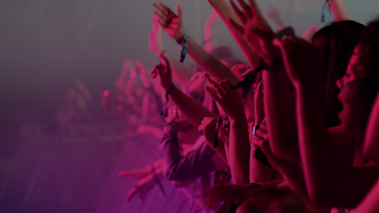 The crowd cheering at an event