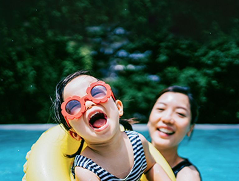 mother and daughter in swimming pool