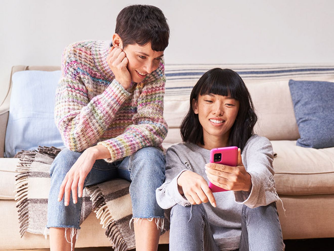Couple looking at phone.