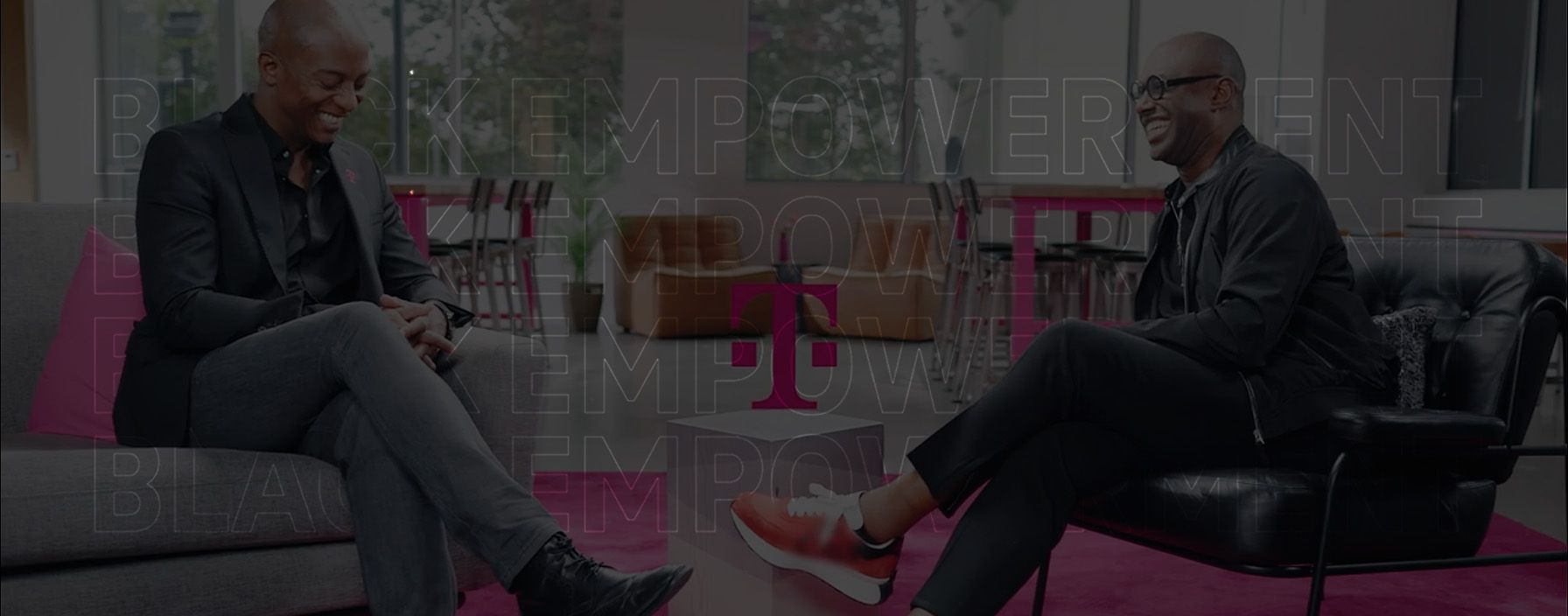 Maurice James, Vice President of Marketing at T-Mobile, sits across from Chief Digital Officer Marcus East.