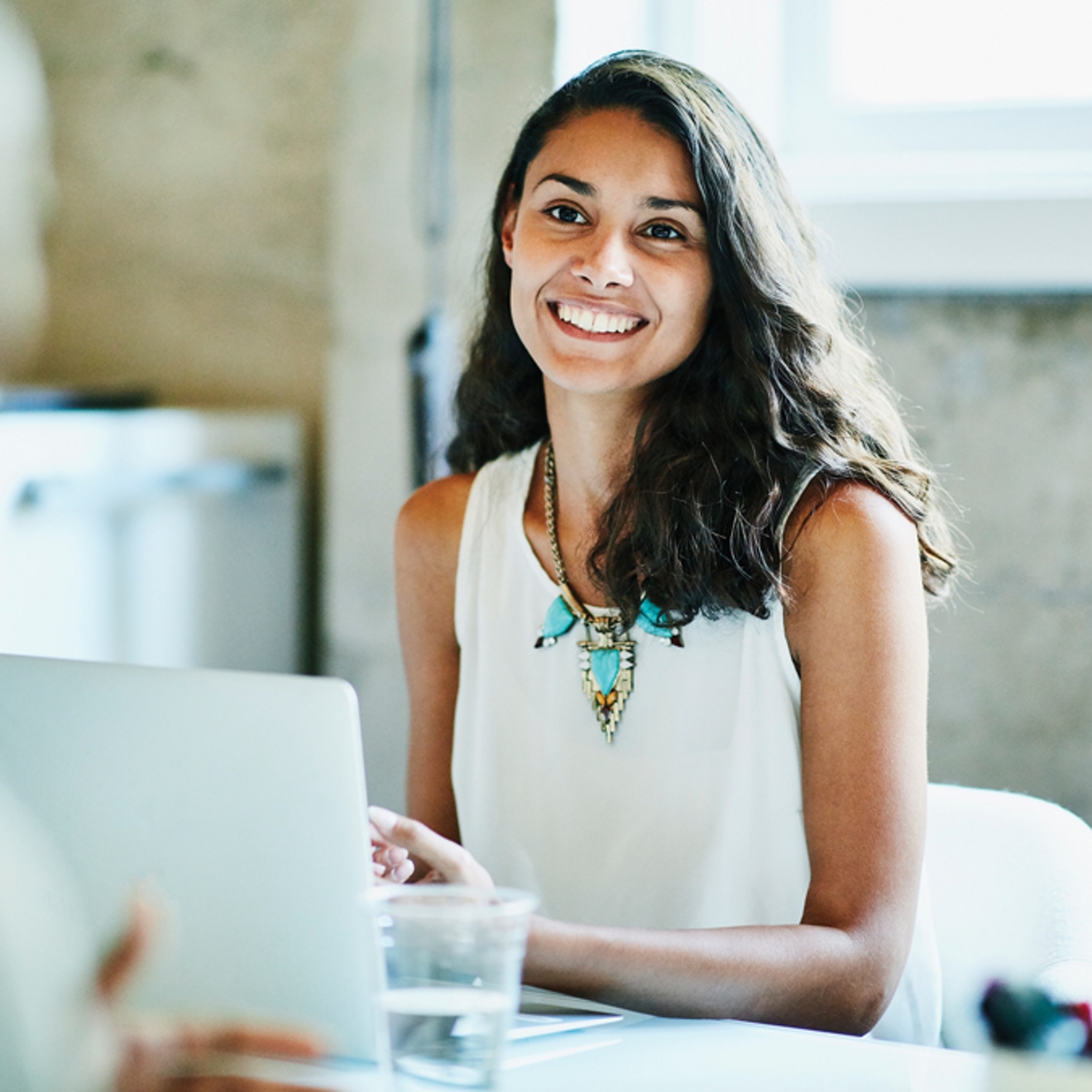 Person using laptop in workplace