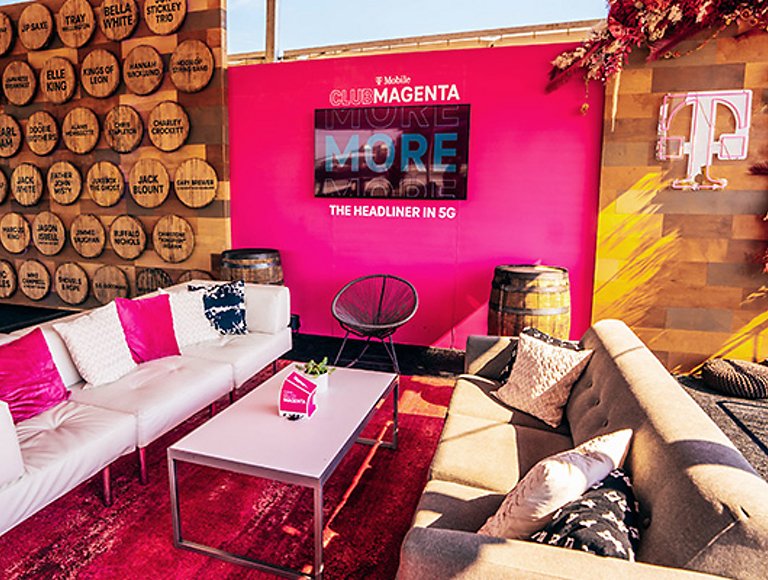 Inside a Club Magenta lounge with fun, bright colors and comfortable furniture.  