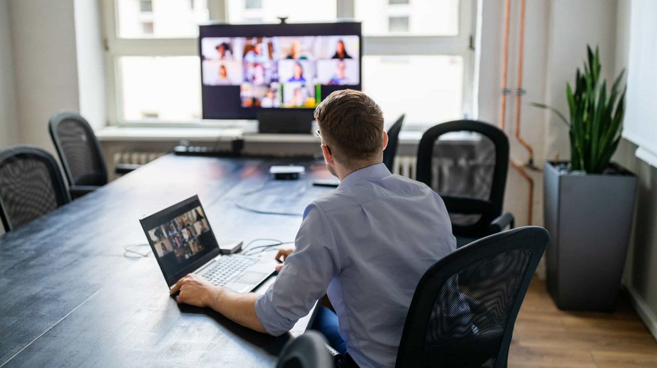 A T-Mobile Service Delivery Manager meets with client stakeholders in a video call.