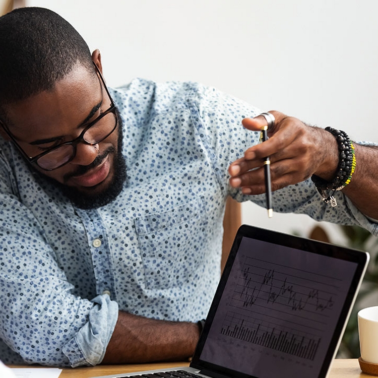 People reviewing scientific data on a laptop.