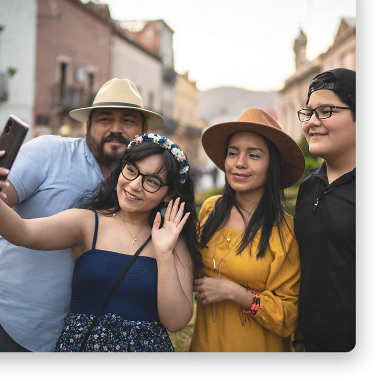 Family of four posing for a selfie.