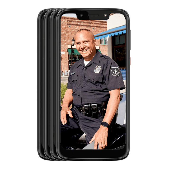 A police officer smiling at the camera