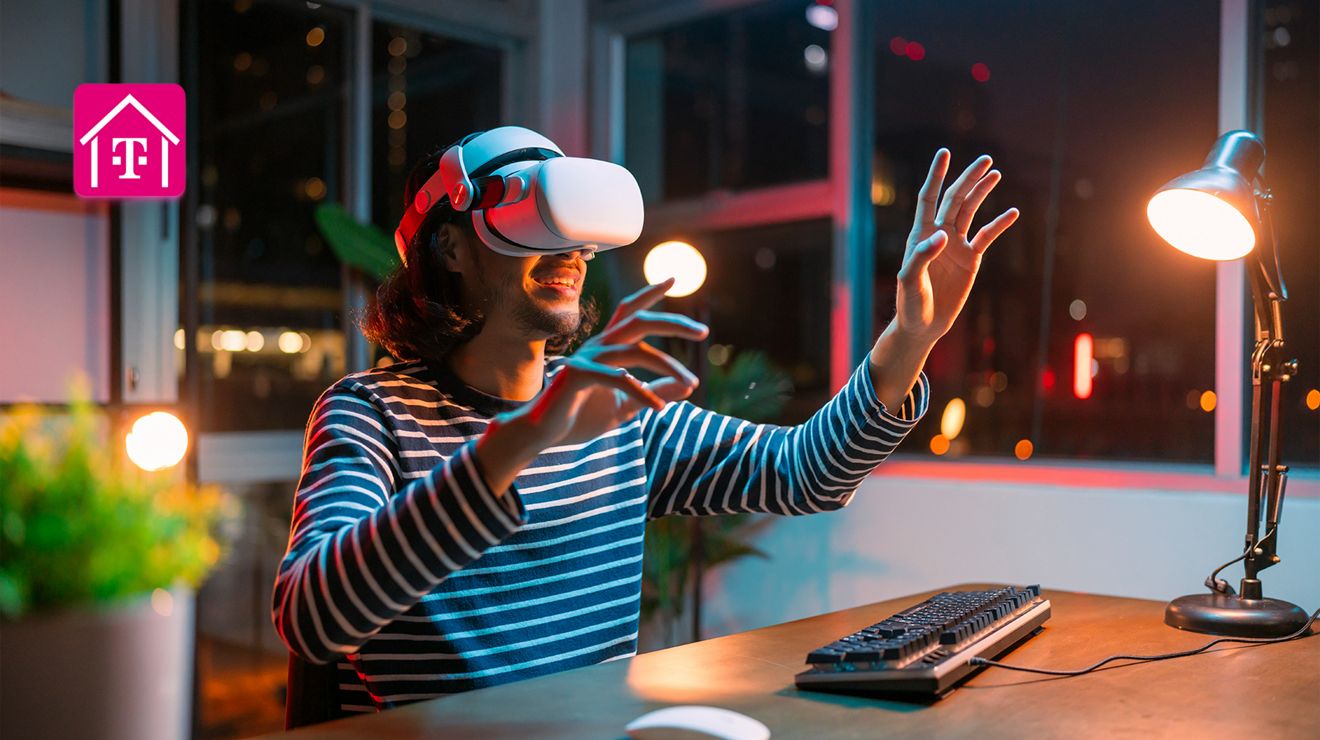 Smiling individual wearing a VR headset at a desk, with the T-Mobile Home Internet logo.