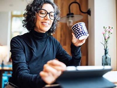 A senior woman looking at her tablet