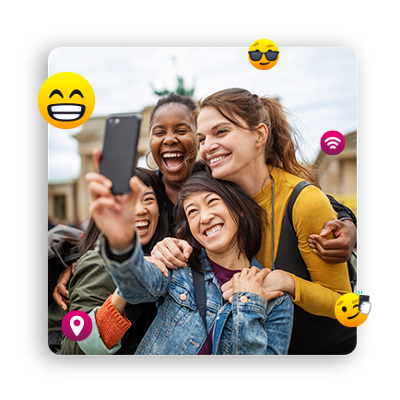 Group of people posing for selfie.