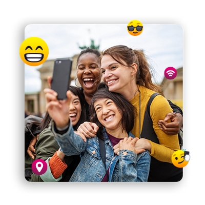 Group of people posing for selfie.