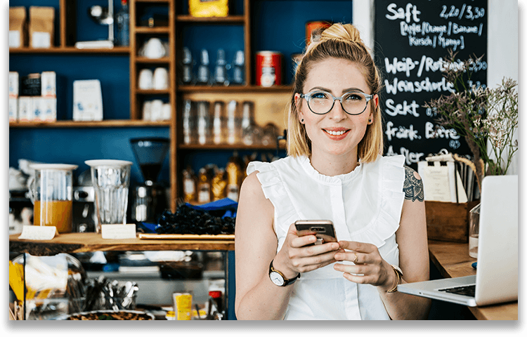 Woman using phone as personal mobile hotspot for internet